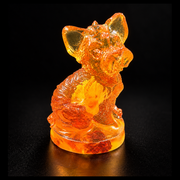 Made in USA natural Baltic amber Yorkshire Terrier figurine on amber base, sitting mini Yorkie with pointed ears glowing honey-cognac on black studio background — KIZIMA® Brooklyn NY