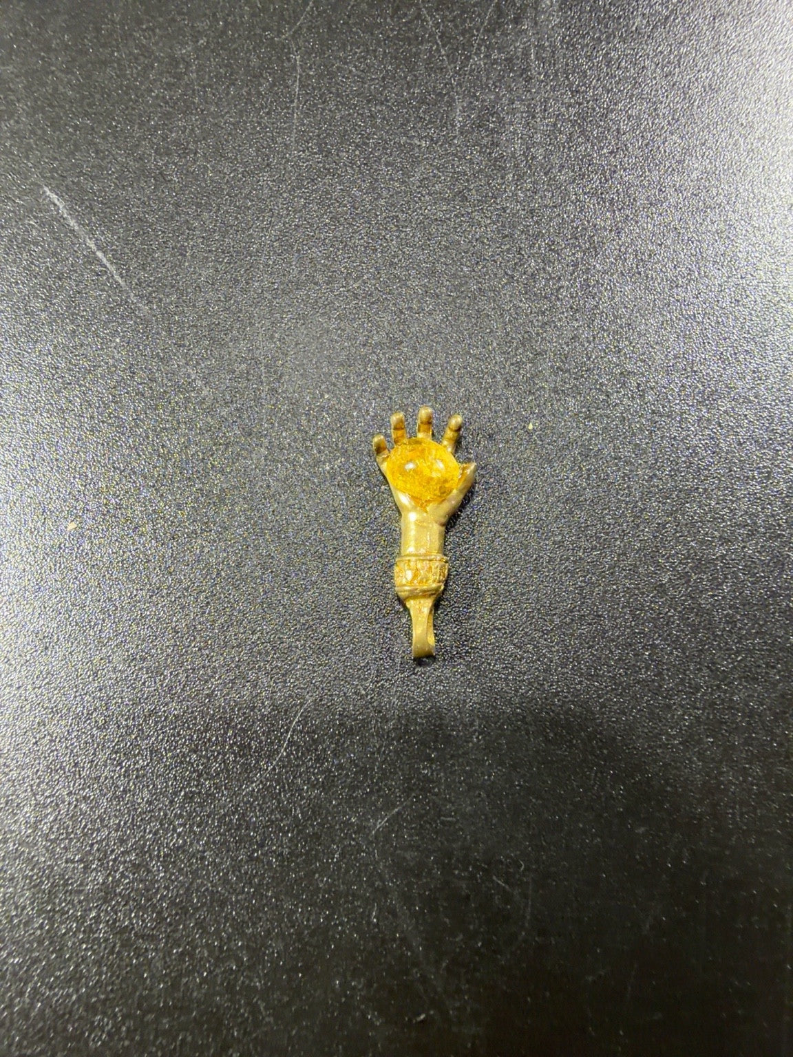 Made in USA Natural Baltic Amber money hand amulet by KIZIMA®, metal hand holding amber, original product photo