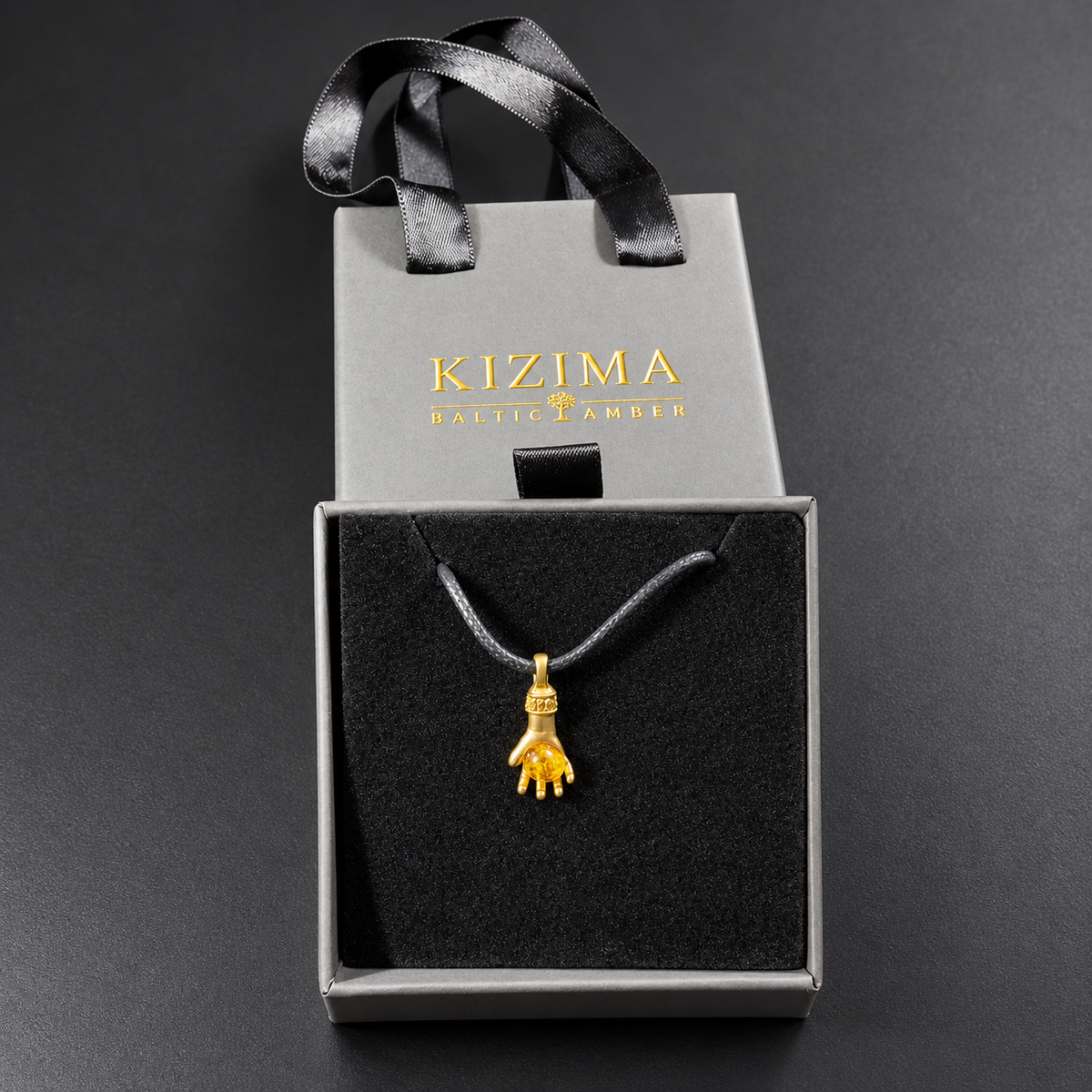 Made in USA Natural Baltic Amber money hand pendant by KIZIMA® in its gift box with matching ribbon-handle gift bag