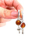 Handmade Baltic amber key and lock pendant earrings by KIZIMA® — romantic amber jewelry, made in USA