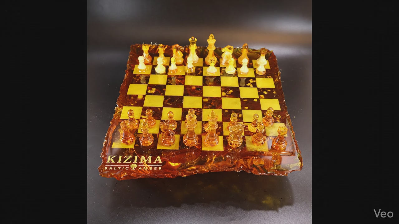 Load video: Luxury Baltic amber chess set inspired by the Baltic Sea with sculptural wave edges and handcrafted chess pieces by KIZIMA®