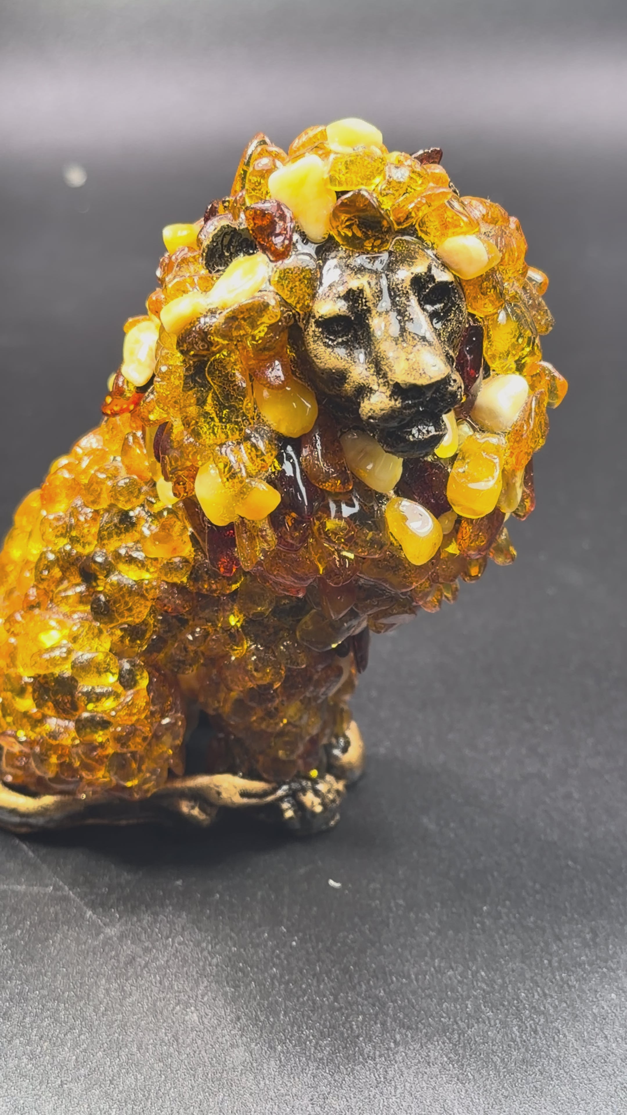 Load video: Lion Baltic Amber Figurine — Made in USA | KIZIMA®