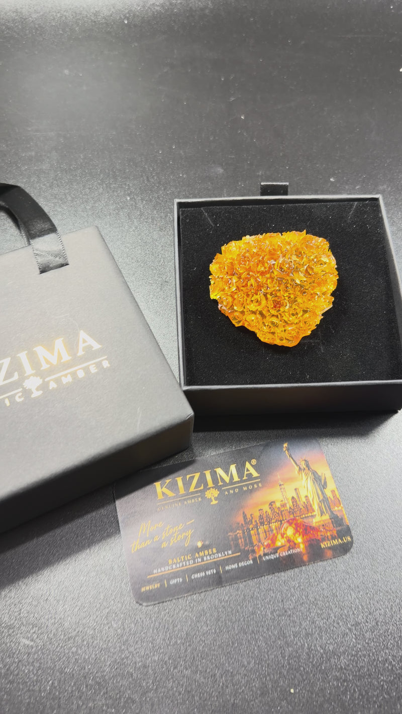 Video of the Made in USA Natural Baltic Amber rose heart by KIZIMA®, hand-set amber roses turning in the light, gift for her