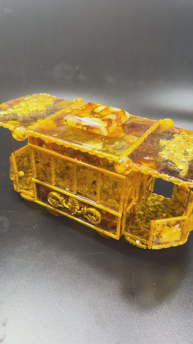 Natural Baltic Amber tram trolley jewelry box video showing genuine amber glow and handcrafted details