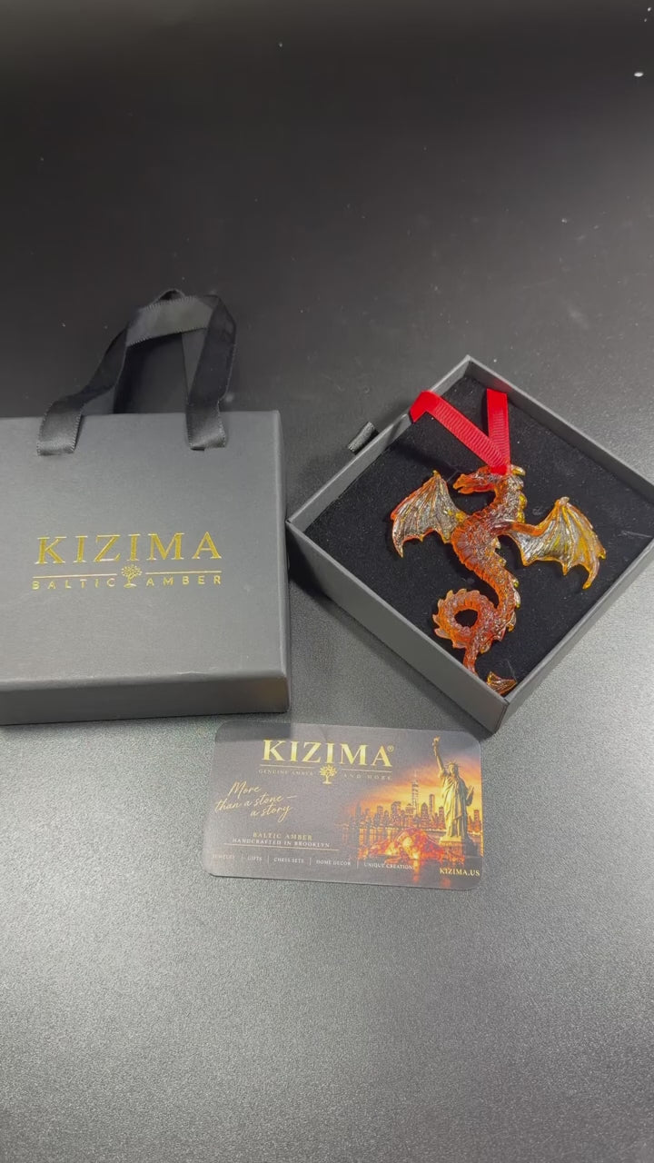 Video: natural Baltic amber gold dragon car charm by KIZIMA® turning in the light — handmade keychain for the car, Made in USA