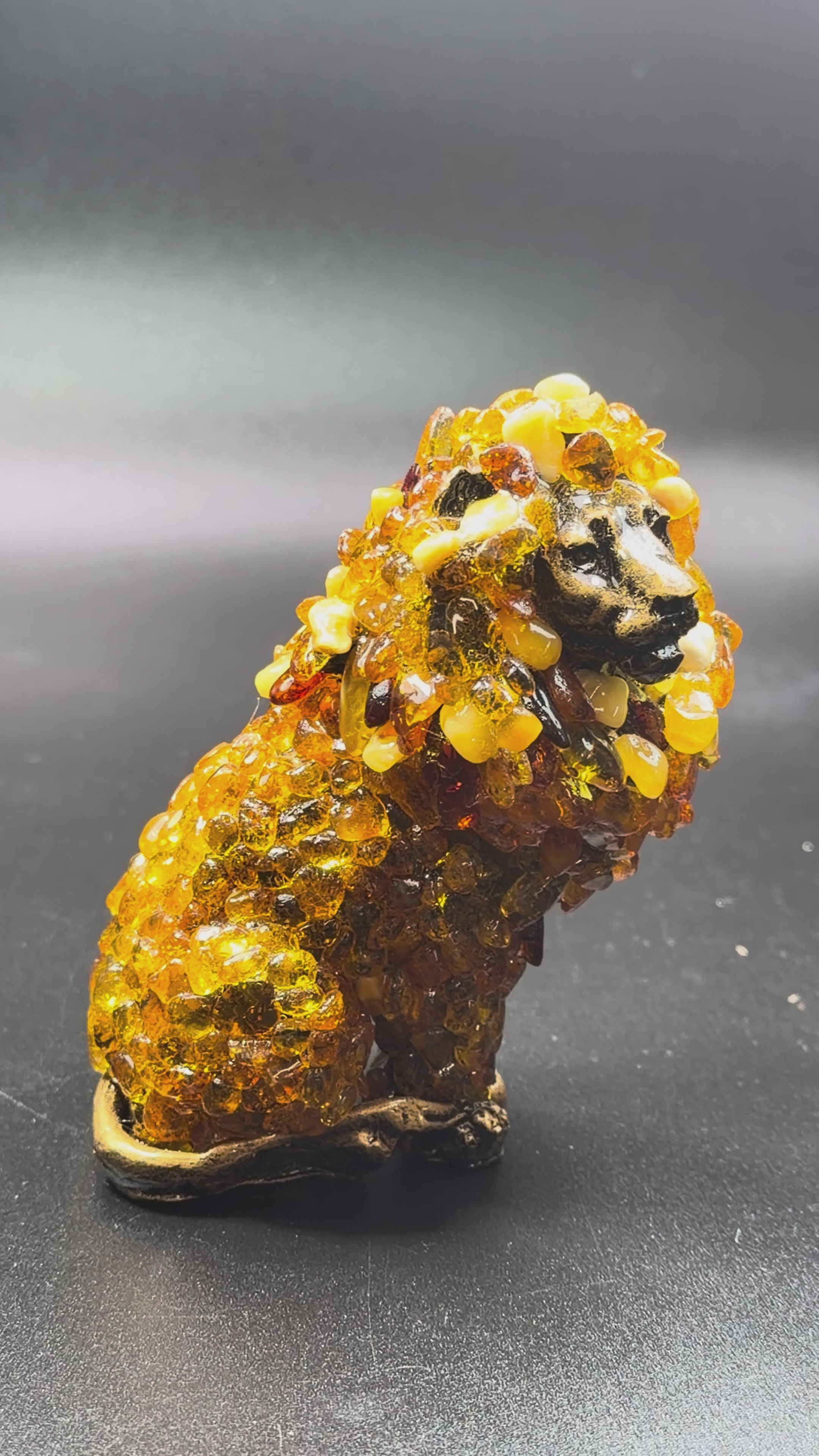 Load video: Lion Baltic Amber Figurine — Made in USA | KIZIMA®