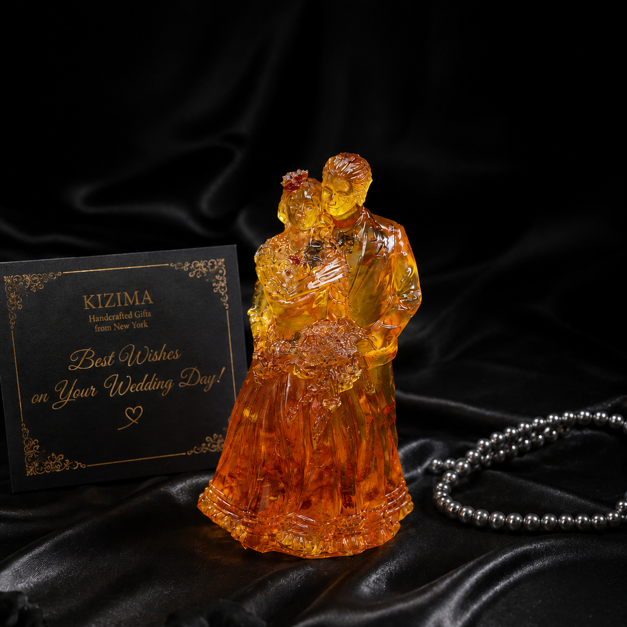 Romantic amber couple figurine, angled view highlighting natural amber color variations